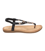 Sandalias de dedo planas para mujer SKYDIVA KELOKÉ en color negro, vista lateral derecha